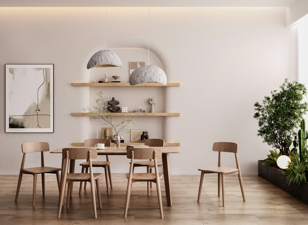 A finished dining room with pale timber chairs, open shelving and pendant lights